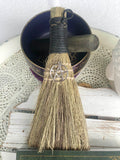 Black Pentacle Broom - Protection  This besom is a versatile handheld broom of stiff grass, bound with black cord and decorated with a silver Pentacle symbol charm.